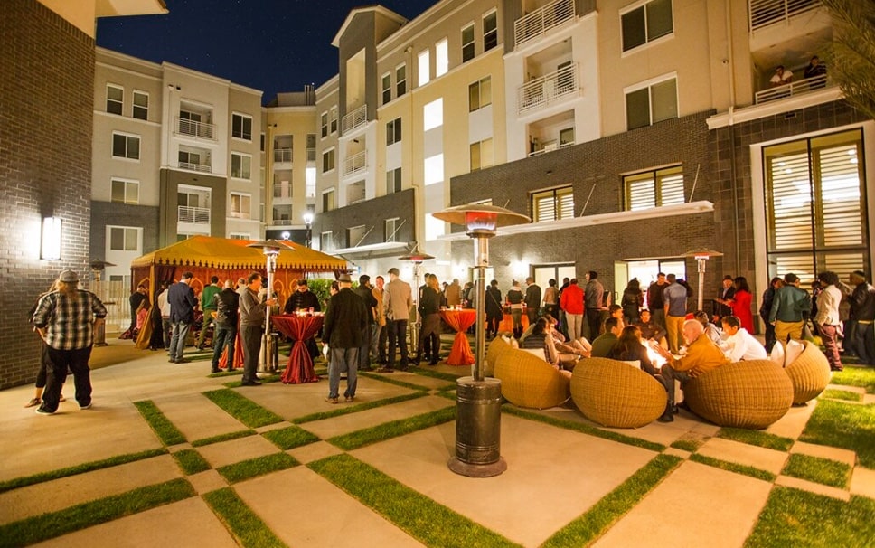Apartment residents at a get together in the courtyard.